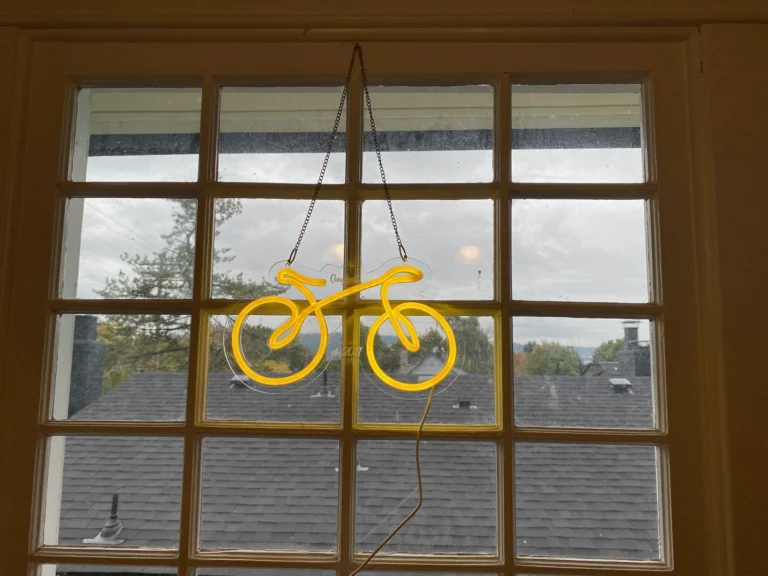 Yellow Neon Bike if Portland Oregon Window